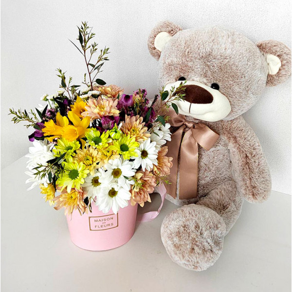 Teddy bear and flowers